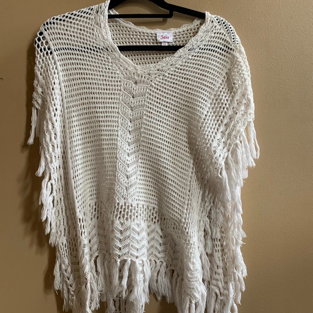 A white crochet cardigan without sleeves